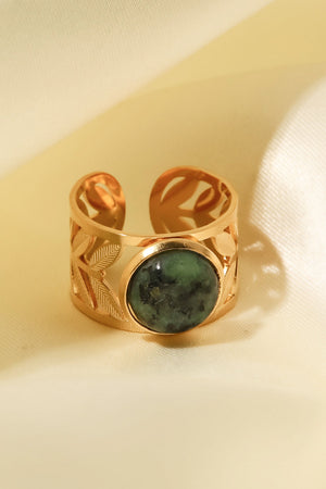 Gold ring with leaf cutouts and a malachite stone