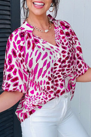 Vibrant leopard print V-neck blouse with short sleeves and a relaxed fit.