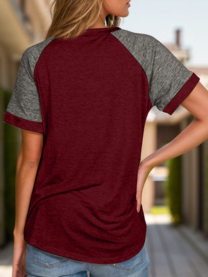 Burgundy and dark gray raglan sleeve tee with short sleeves and a crew neck.
