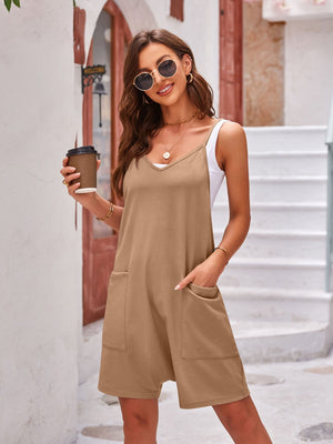 Camel layered V-neck romper with oversized pockets and spaghetti straps.