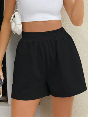 Black relaxed fit sweat shorts with elastic waistband and side pockets