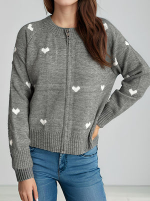 Gray zip-through knit cardigan with white heart print and ribbed cuffs.