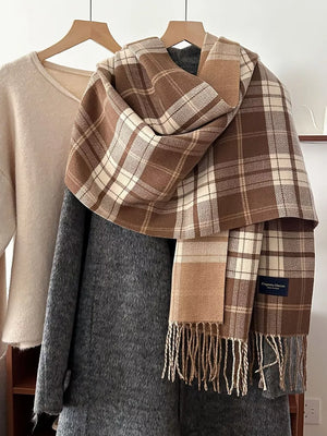 Timeless plaid scarf in tan and cream with fringe detail.