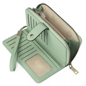 Sleek pu leather mini wallet in gum leaf with snap closure, card slots, and wrist strap.