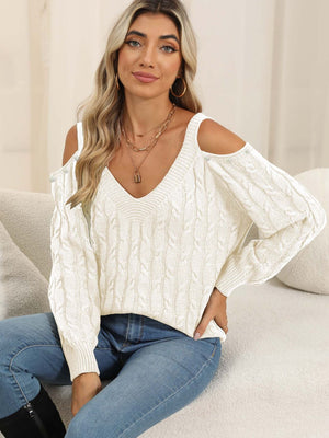 White cable knit cold shoulder sweater with button details and V-neck