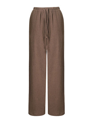Brown crinkled wide-leg drawstring pants with a relaxed fit.