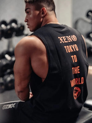 Black Xeno Tokyo graphic muscle tank top with orange text and globe graphic.