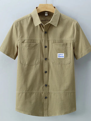 Men's short-sleeve cotton shirt in Apricot with two chest pockets and button front.