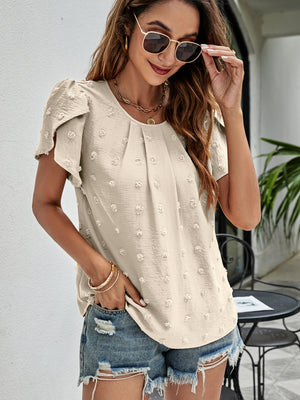 Beige textured dot puff sleeve blouse with ruffled sleeves and a scoop neckline.