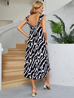 Black and white graphic print tiered midi dress with ruffle straps and a low back.