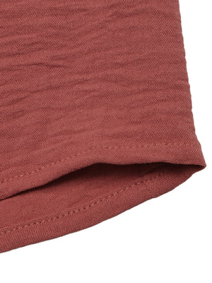 Plunging V-neck maxi dress in rust red textured fabric with tiered detail.