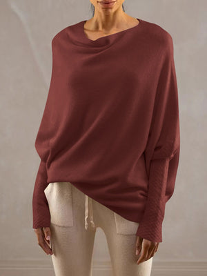 Burgundy off-shoulder knit sweater with textured cuffs and batwing sleeves.