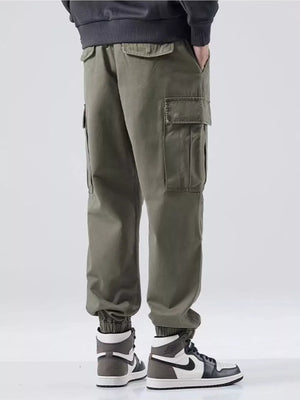 Plus-size relaxed fit cargo sweatpants in Army Green with multiple pockets and cuffed ankles.