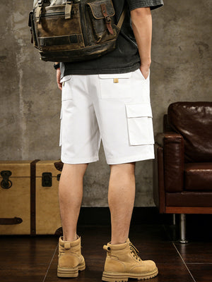 White cargo shorts with multiple pockets and drawstring comfort detail.