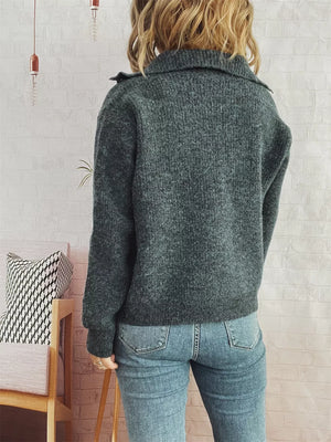 Gray ribbed cardigan with polo collar and button-up detail, worn with jeans.