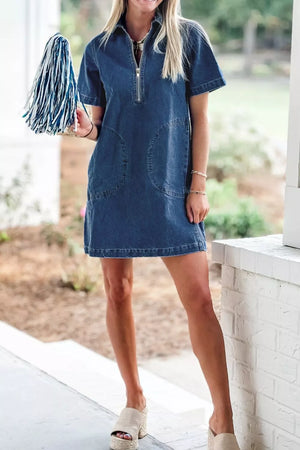 Denim collared mini shift dress with zip front and patch pockets.