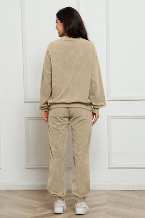 Beige corduroy lounge set with crewneck sweatshirt and jogger pants.