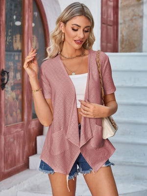 Perforated blush pink shawl collar jacket with short sleeves and pockets.