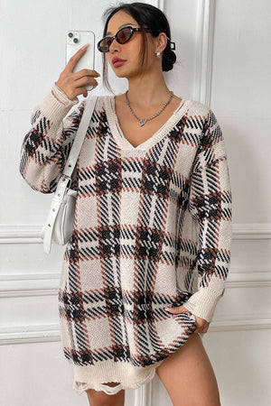 Plaid knit mini dress with distressed hem and v-neck.