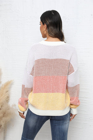 Horizontal stripe waffle knit pullover sweater with color block pattern in apricot and white.