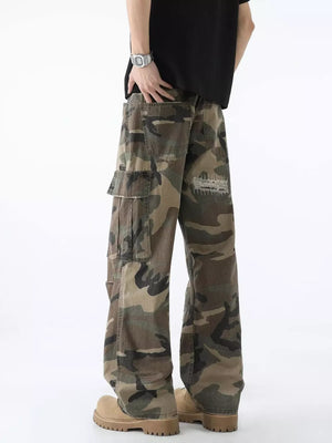 Men's distressed camouflage wide leg cargo pants with large pockets and a graphic detail on the back.