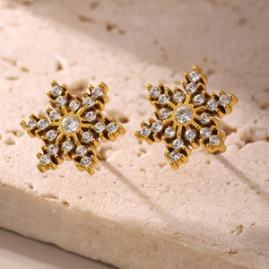 Celestial Gemstone Snowflake Studs earrings in 18K gold-plated metal with clear gemstones.