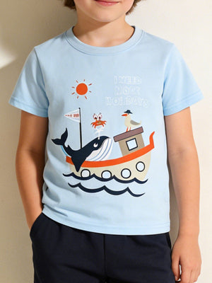 Light blue cotton t-shirt with a whimsical sea adventure graphic featuring a whale, crab, seagull, boat, and text.