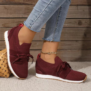 Burgundy knit & suede lace-up sneakers with white soles.