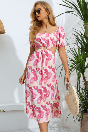 Pink floral midi dress with puff sleeves, square neckline, and waist cutouts.