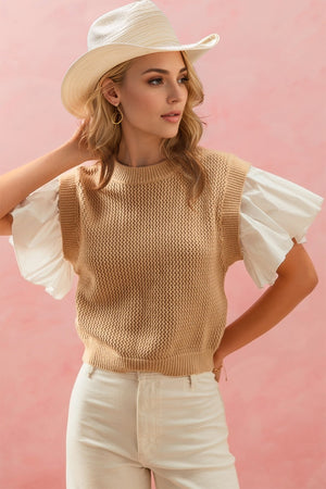 Knitted vest with ruffled poplin sleeves in black or camel.
