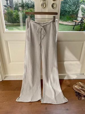 Maternity striped wide leg pants in grey and white with drawstring waist.