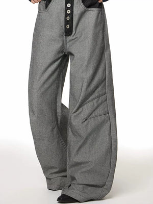 Men's grey cotton wide leg jeans with button fly and unique panel detailing.