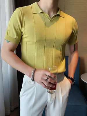 Textured knit polo shirt in light yellow with vertical ribbing and short sleeves.