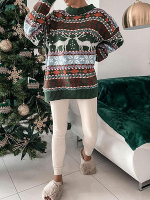 Fair Isle knit sweater with reindeer and snowflake motif in green, brown, and cream.