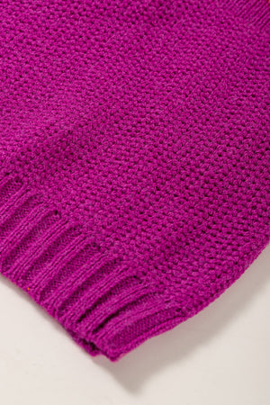 Colorblock ribbed knit pullover in magenta with a textured stitch and ribbed hem.