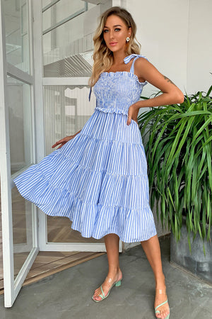 Pastel blue striped smocked bodice tiered midi dress with tie straps