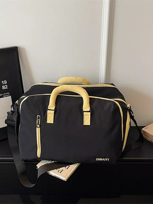 Black travel organizer bag with yellow accents and adjustable strap
