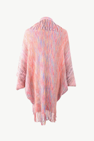 Textured stripe fringe cape in blush pink with multicolor yarn and fringe detail.
