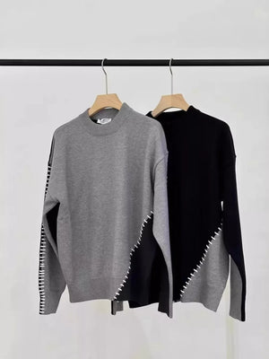 Men's gray and black two-tone mock neck sweater with contrast stitching detail.