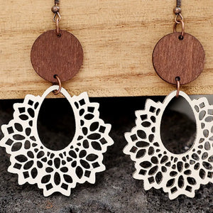 Floral laser-cut wooden drop earrings with ivory lace detail and tan wood circles.