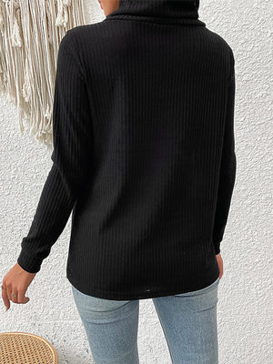 Black ribbed turtleneck sweater with asymmetric button detail