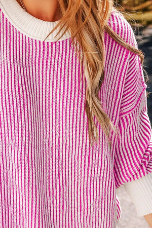 Hot Pink and white striped knit sweater with crew neck and drop shoulders.