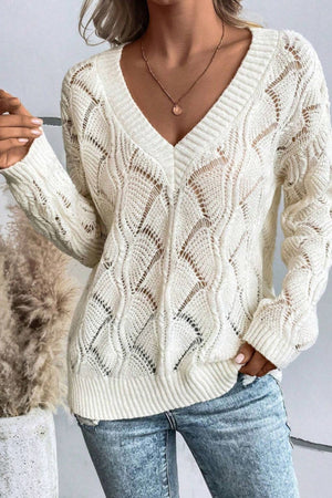 Ivory openwork knit v-neck pullover sweater with diamond pattern and ribbed trim.