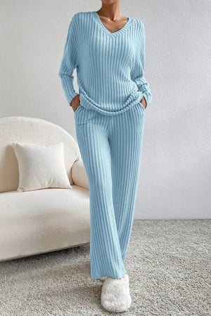 Light blue ribbed knit lounge set with V-neck top and wide-leg pants.