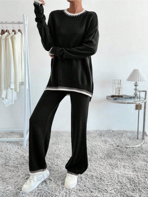 Black knit loungewear set with white contrast trim on neckline, cuffs, and hem.