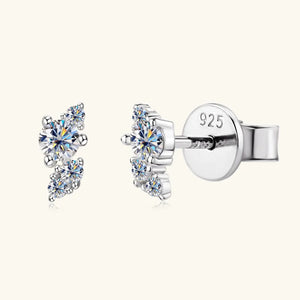 Silver stud earrings with a cluster of clear round cubic zirconia stones.