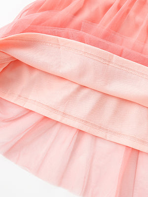 Pink toddler tulle dress with layered fabric detail.