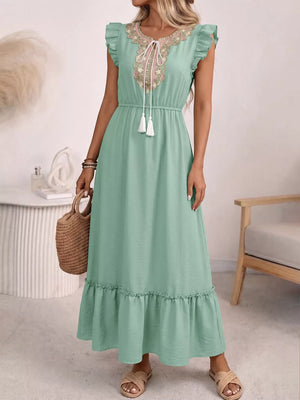 Mint green embroidered tie neck maxi dress with ruffles and tassels.