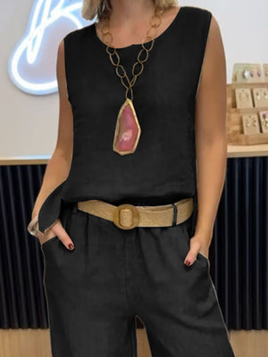 Black relaxed fit tank and wide-leg pants set with a statement necklace.