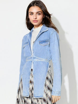 Medium wash denim wrap jacket with asymmetric hem and tie waist detail.